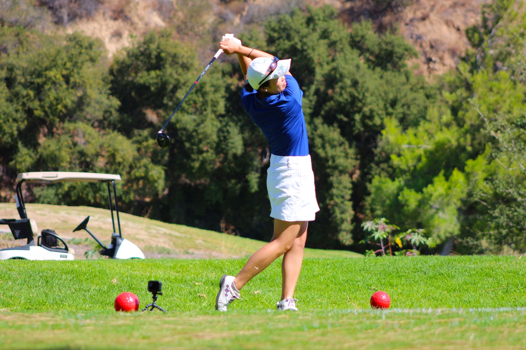 Shizuka Okochi follows through on her first tee shot of the round Momday. Image: Chris Peterson